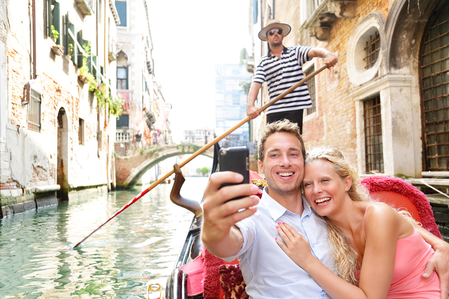 Couple in Venice on Gondole ride romance in boat happy together