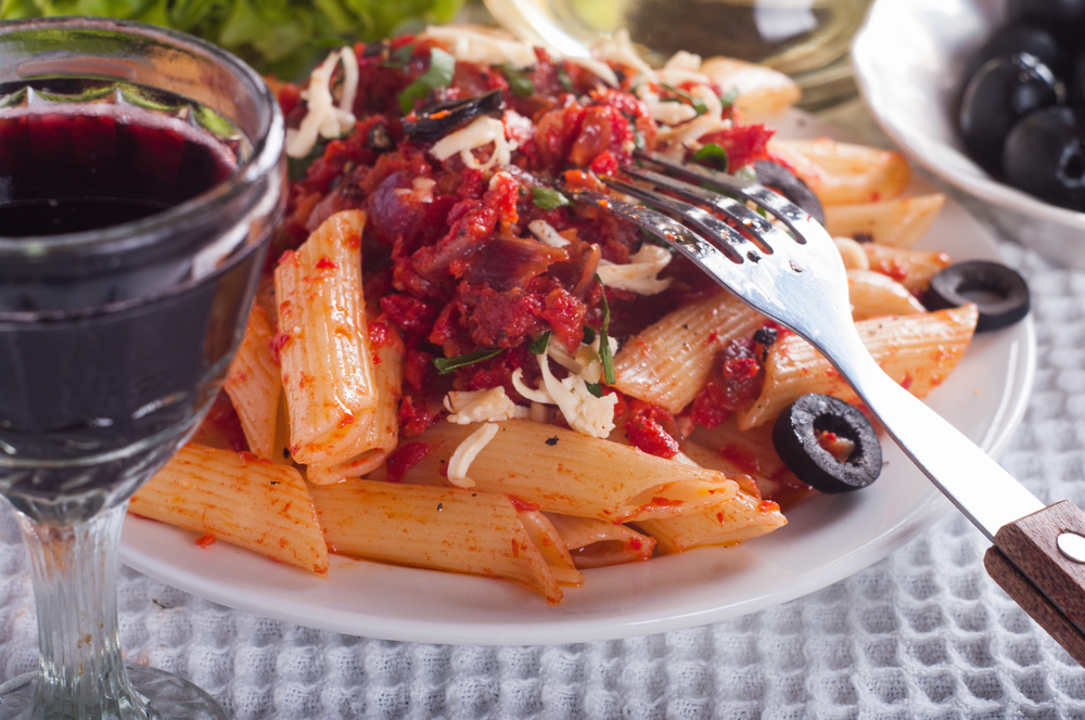 Classic Italian pasta with tomato sauce and Parmesan on Italy tour