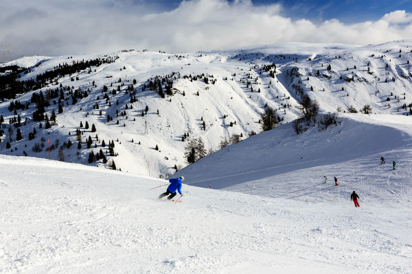 Skiers at Passo Campolongo on a winter tour of Italy