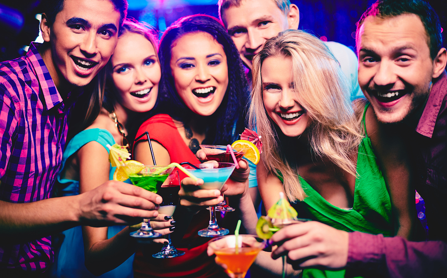Friends enjoying aperitivo cocktails during Italy vacation